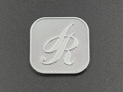 Diagonal-brushed nickel nameplate